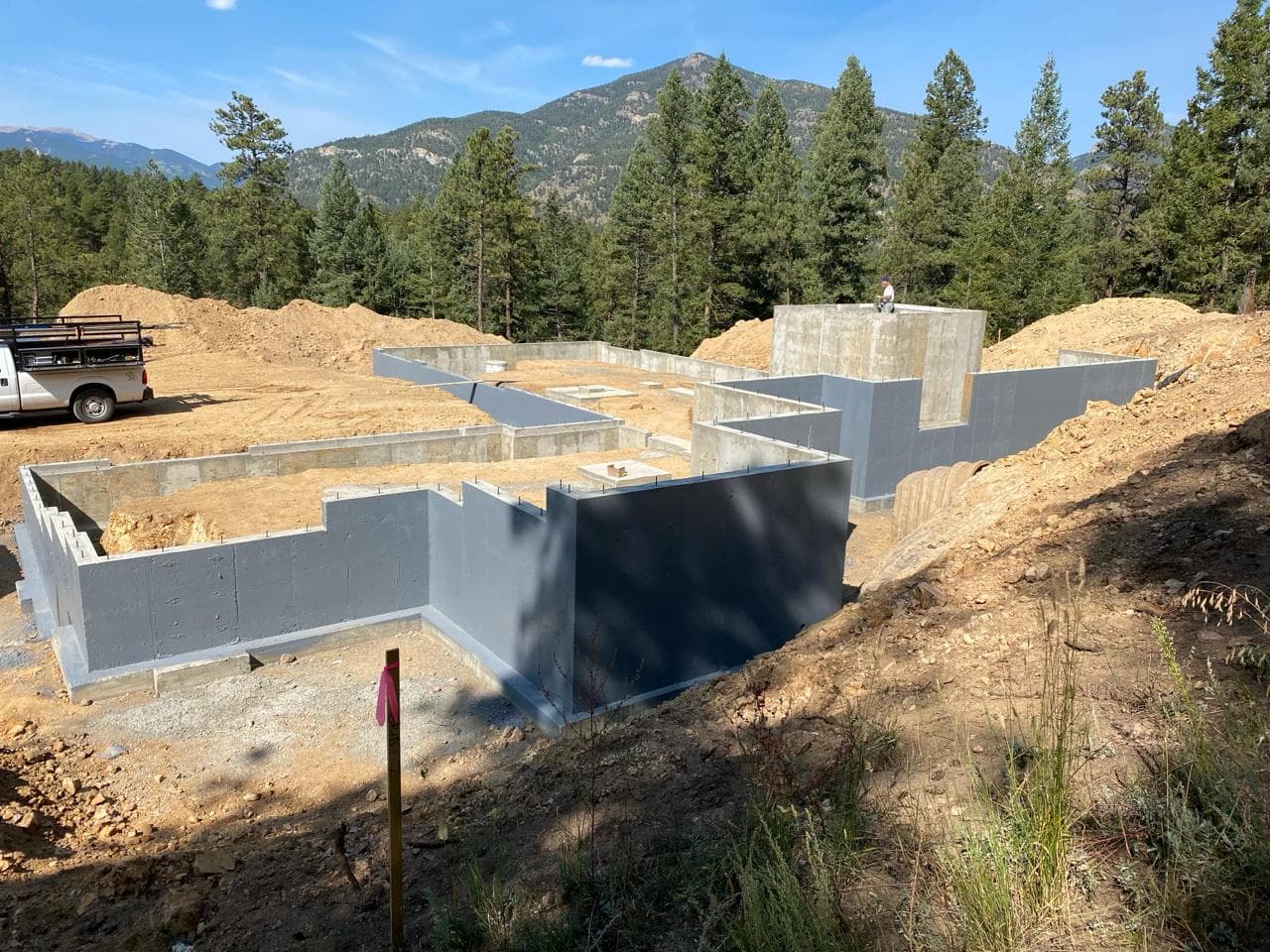 Foothills Concrete — custom home foundation with concrete vault on a Colorado mountain lot